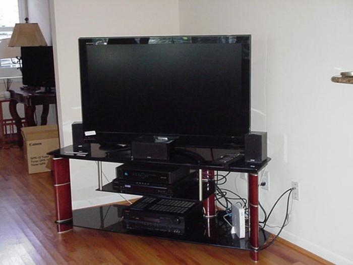 Toshiba flat screen and tempered glass, wood and metal stand