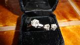 pair of ladies white gold diamond stud earings, having two matched full cut diamonds set in 4- prong double wire heads with heavy duty friction backs stamped 14kt. The brilliant full cut diamonds weight 1.50 carats, total weight J;SI1-SI2: extra fine make
