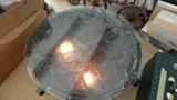 designer glass and rattan table lighted from beneath, plate glass top, diamond shaped bottom.