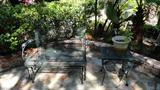 IRON PATIO TABLE AND 4 CHAIRS, BROWN AND JORDEN