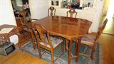 antique mahogany dining table with 4 leaves and six chairs , very good condition