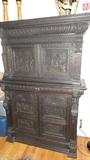 great walnut gothic antique closed door chest with two hidden draws, carved heads and animals