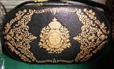 tooled leather box handbag with gold brush designs