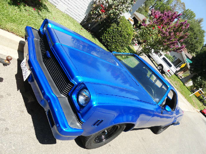 1973 Chevy El Camino - small block 350 with r/v Cam, Moroso valve covers, Holly 650 Carb, Edelbrock Manifold, and a Turbo 350 auto trans. It has shaved door handles, neon stereo lighting, custom sound system, new Hurciliner bedliner, Recaro style bucket seats, custom dash panel along with Stewart Warner gauges, and fresh epoxy coated rims. No Smog Needed.