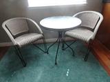 newer wicker table and two chairs