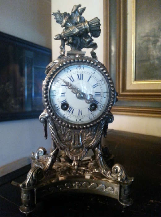 Atique silver resist french table clock, has a wonerful  soft bell strike