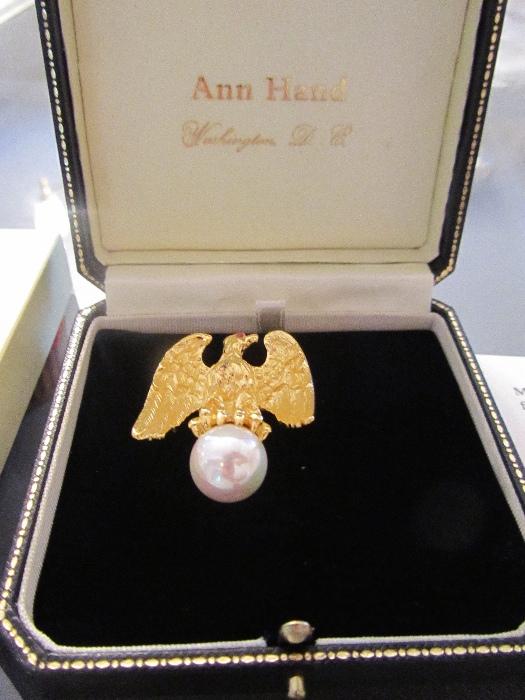 Ann Hand Design Eagle Pin Sterling  with 18 K gold plate, with a ruby eye and faux pearl