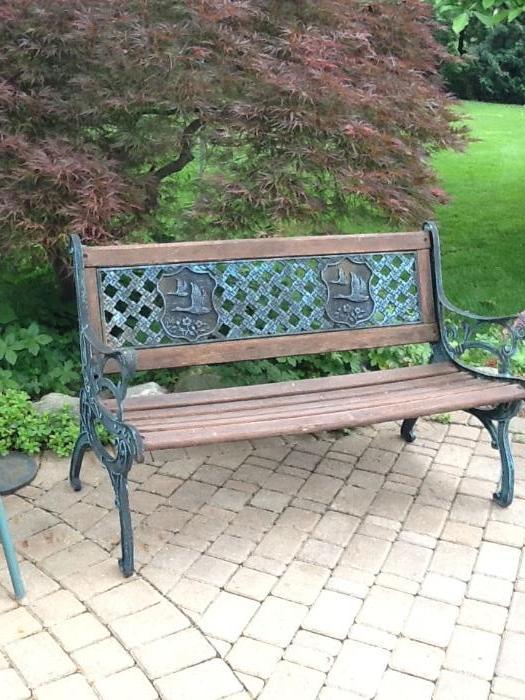 teak and wrought iron bench