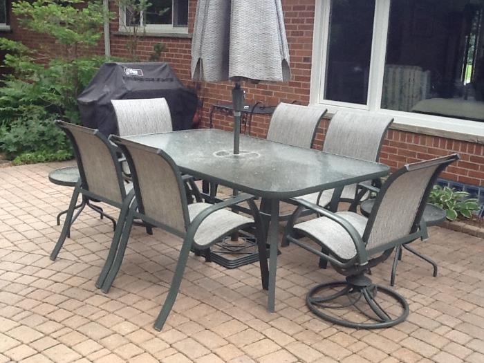 Patio table, 4 arm chairs, 2 rocking swivel chairs