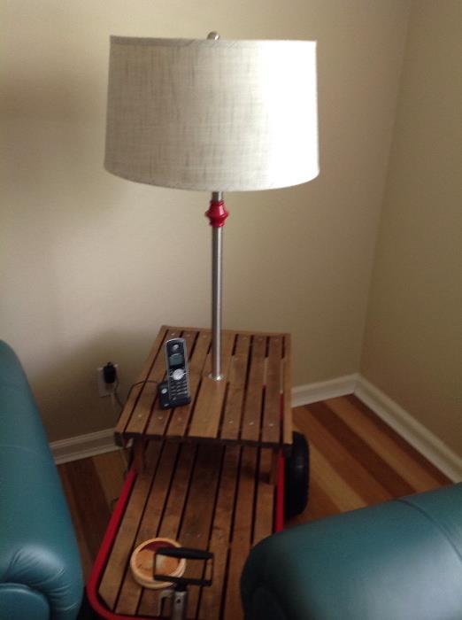 One of a kind side table made from a red wagon with built in lamp