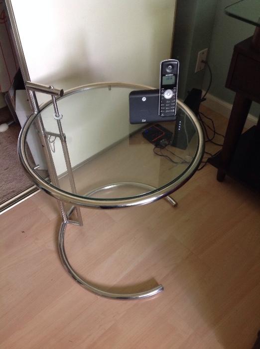 Chrome and glass round side table. Eileen Grey style