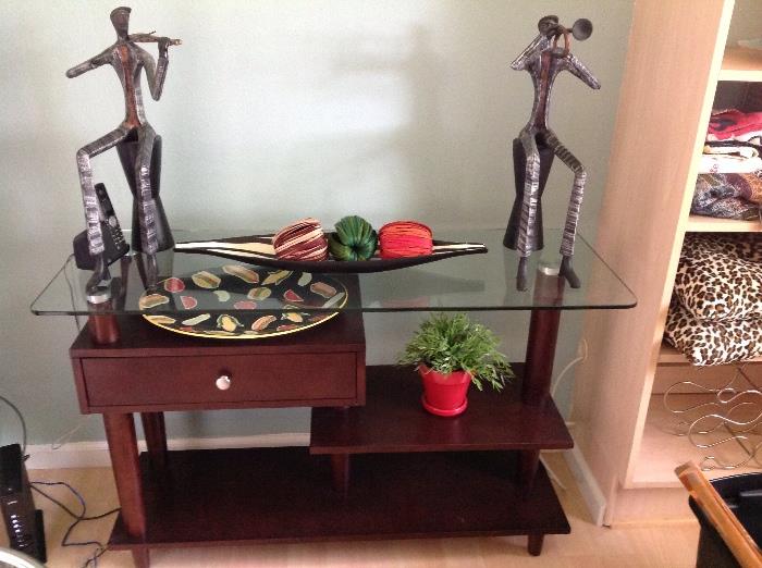 Dark brown media console or display table