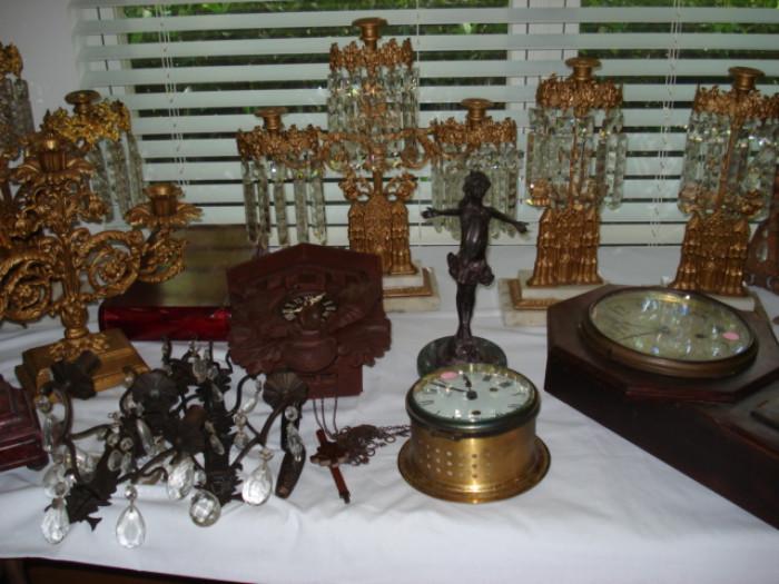 Ornate candle holders and more clocks