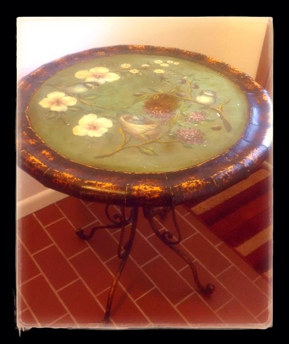 Metal table painted with bird and nest