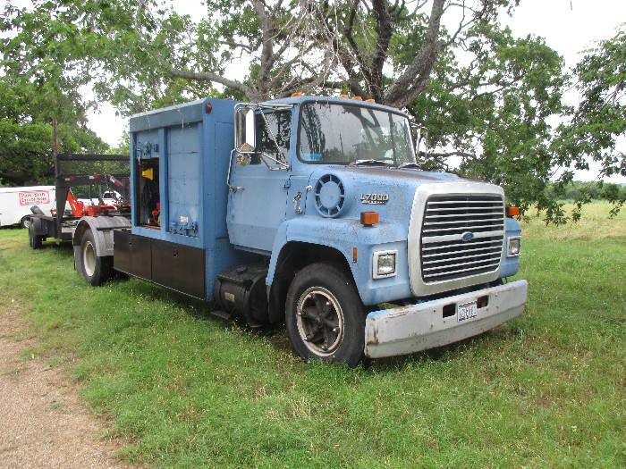 1988 Ford L7000 6 cyl diesel with 11,529 miles.  It has an 80 amp alternator and 6 speed transmission.  It has a Monroe Custom Utility Body 