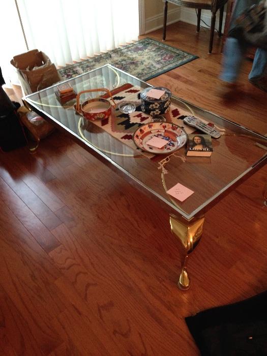 Glass table with gold accents