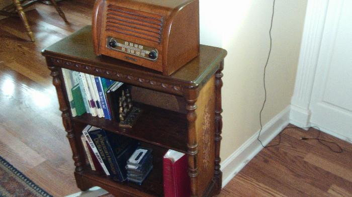 Wonderful old radio case that is turned around and used as a book case.  Great old radio on top!
