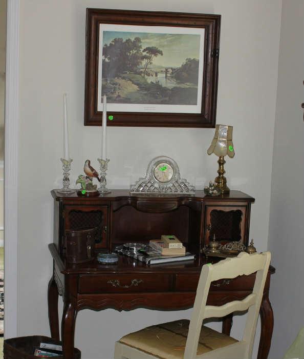 Beautiful mahogany secretary with items and picture above. Chair with silk fabric.