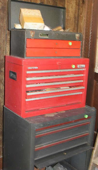 Craftsman tool boxes with some tools and other things in them.