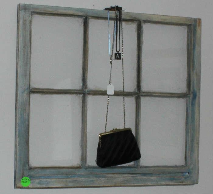 Distressed blue window.  Knobs have been added at the bottom since this picture has been taken.