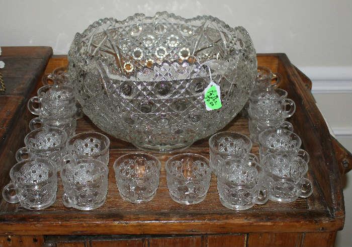 Glass punch bowl with 18 cups and ladle.