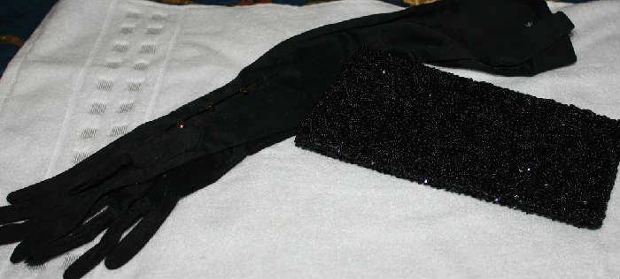 Long black dress gloves with black beaded evening bag.  Several sets of gloves available.