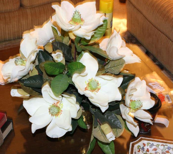 Beautiful magnolia arrangement on coffee table in den.  They look so real.