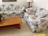 Matching sofa and love seat shown with teakwood coffee table