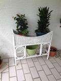 Wicker planter shown with plants