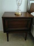 Mid Century Modern nightstand has a matching headboard