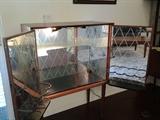 Showing the inside of the Teak and mirrored liquor cabinet