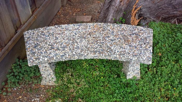 Charming stone bench for backyard or garden.