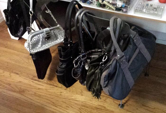 Collection of purses and handbags.