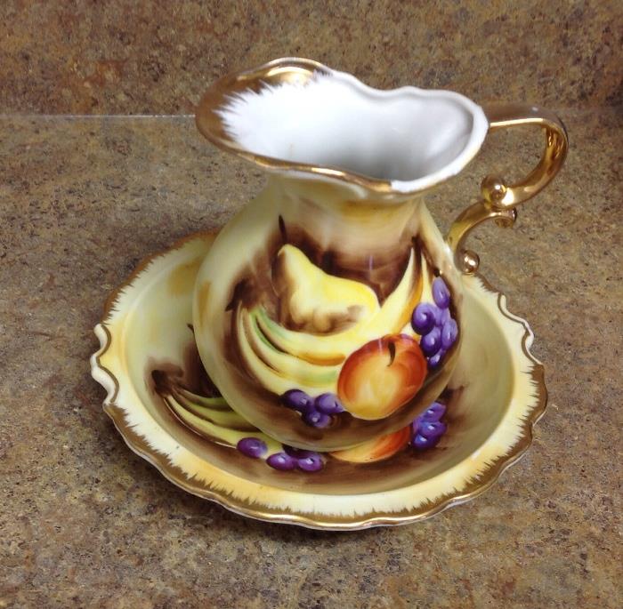 Vintage small pitcher with matching plate