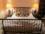 Queen Size Metal Sleigh Bed, Metal and Glass Nightstands, Bronze Lamps.