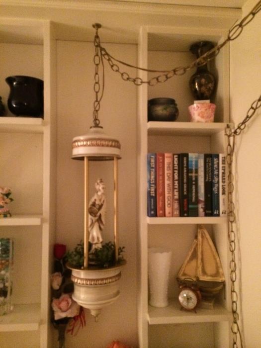 Very 1960s goddess in the hanging statue. Fabulously mid century! Ok. Guys, lights and has oil rain! Works beautifully!! 