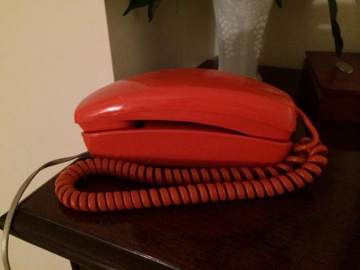 Very vintage orange princess DIAL phone. This phone is in absolutely perfect condition!