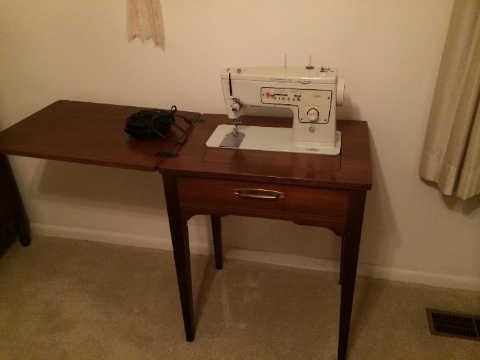 Vintage and working Singer sewing machine and table.