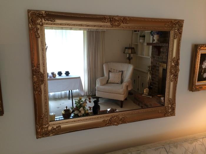 Big, beautiful gold framed mirror. 