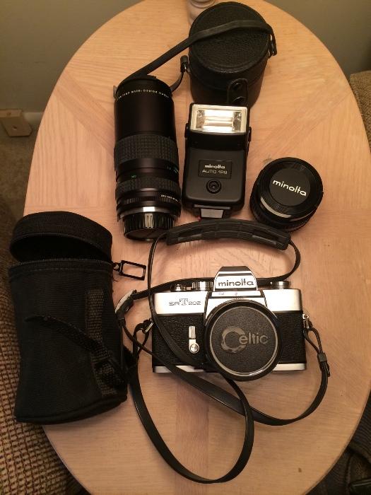 Minolta SRT202 film camera and accessories.