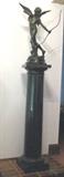 400 - Solid marble dark green early pedestal, 58 in. T, with bronze cupid, 30 in. T, ca. 1900.