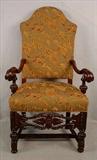 502 - Heavy carved arm library chair with curved arms and green upholstery