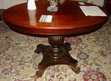 532 - Walnut Victorian oval center table with acanthus carved base, 38 in. L, 27 in. W.