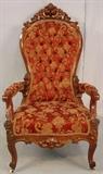 106 - Oversized rosewood rococo arm chair with button tuffed damisk upholstery, 48IN T, 23IN W, 21IN D.