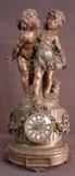 119 - Figural french clock with patented finish and porcelain dial and 2 figures of children, 28IN T, 14IN W