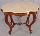 228- Walnut victorian turtle top parlor table with rose carvings, 29IN T, 57IN W, 28IN D