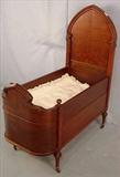296 - Gothic baby bed with bowed footboard. In original finish. ca 1890 47INT, 40INL, 19.5INW