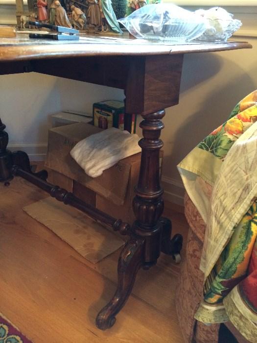 Sorry for this bad photo, but this is a photo of the Legs/Base of the gate leg table in front room.  It has a repair on one foot and the top has some scratches, but this is a really nice piece.  We have it priced to sell with it's flaws.  Someone is going to get a great deal.