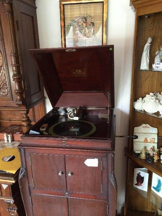 Victor Victrola winds up nice and plays.  Extra reproducer included as well as cabinet below being full of records mostly 78s