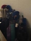Golf clubs and bags... lots of clubs!